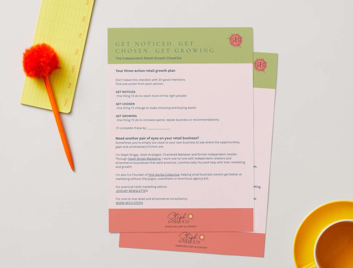 A printed retail growth plan card with pink, peach, and sage green sections lies on a white surface, styled with a yellow measuring tape, a red pom-pom, and a white coffee cup. The card includes the text 'GET NOTICED GET CHOSEN GET GROWING' and a placeholder business letter layout.