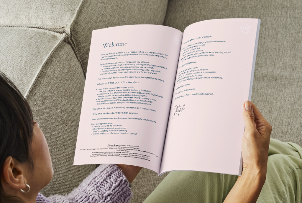 Person reading an open book on a textured surface